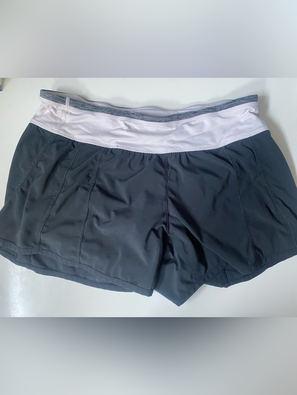 lululemon Women's Black Shorts with White/ Very Light Pink Waistband Size 8